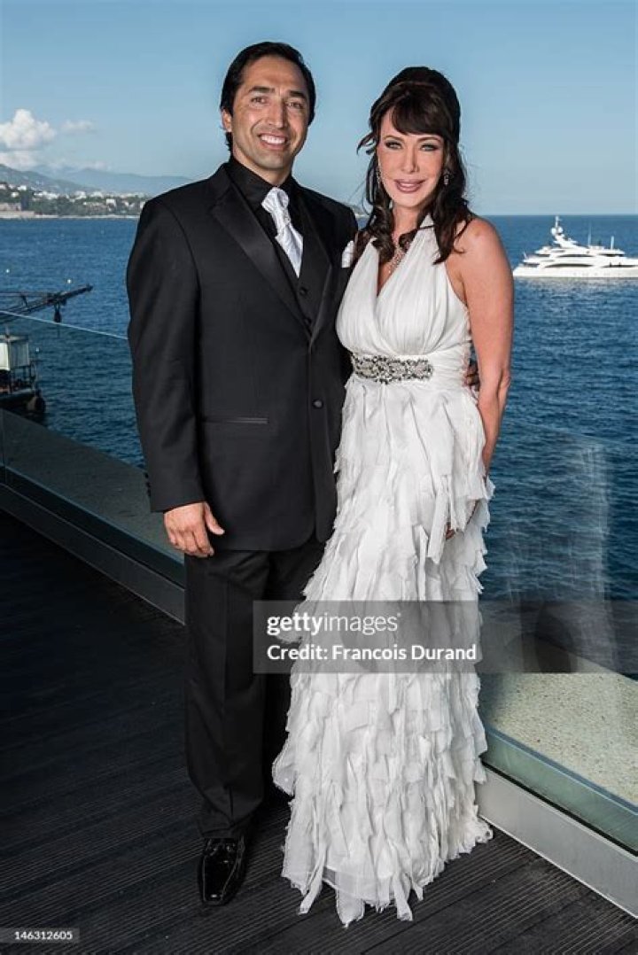 Actress Hunter Tylo and husband Gersson Archila pose for a portrait