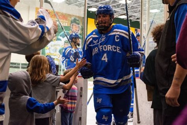 Air Force Academy hockey legend Chuck Delich helps Kiara Romero advance