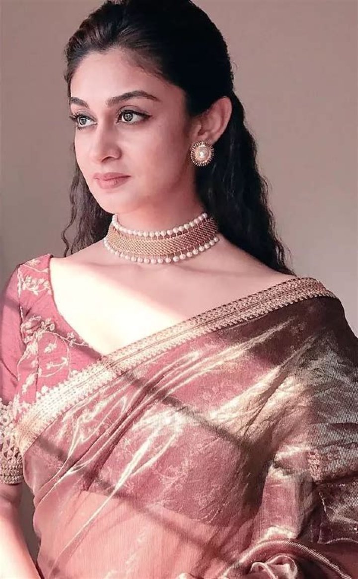 Aishwarya Arjun in Bhargavi kunam Pink Lehenga for her family temple