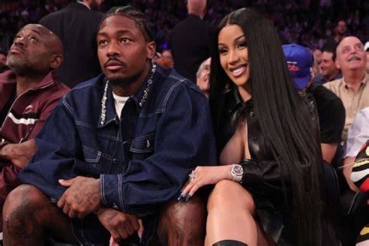 Cardi B shows her growing baby bump in a tee and leggings while out