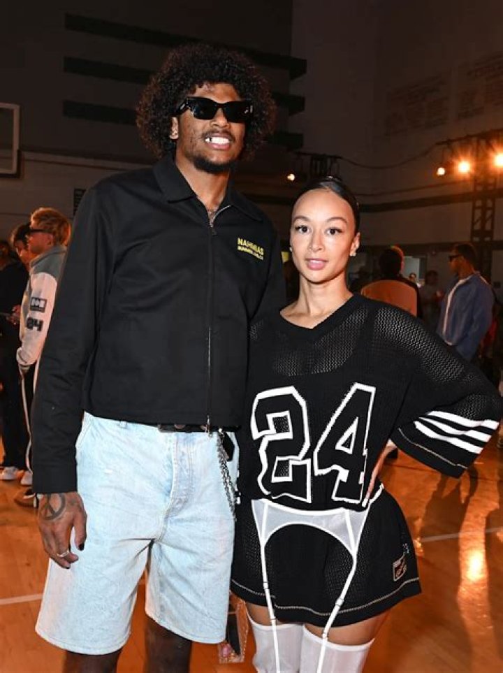 Draya Michele and fianc&eacute; Orlando Scandrick share a kiss at Miami Swim