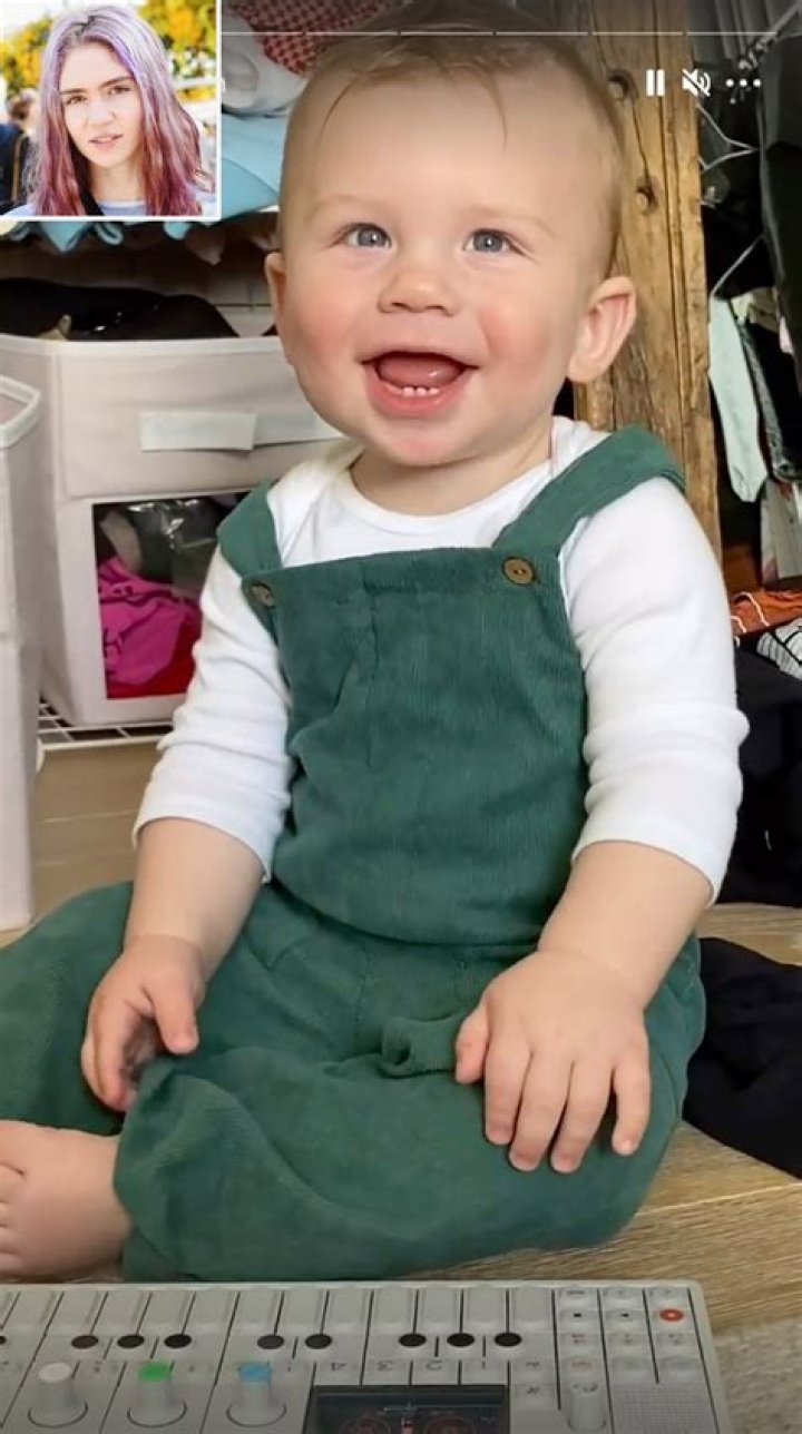 Grimes Shares Video of Son X AE AXii Playing on a Synthesizer