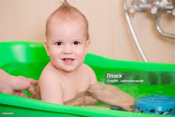 little kid with his mom to clean Stock Photo Alamy