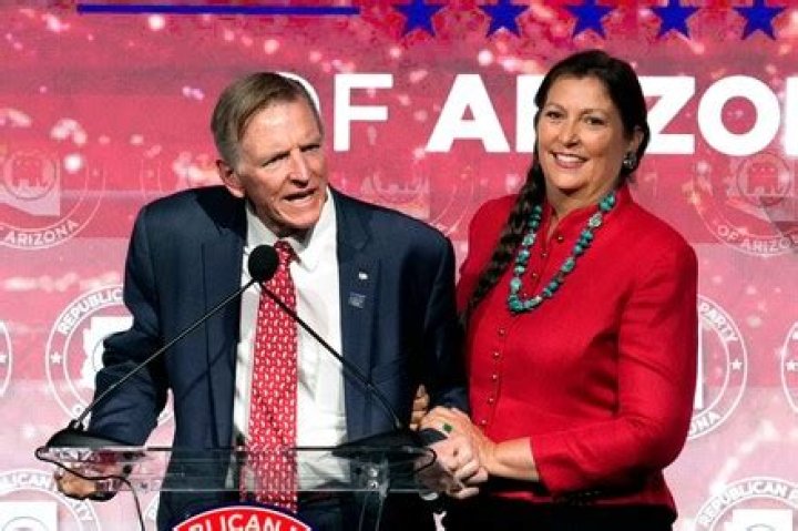Rep. Paul Gosar, left, RAriz., speaks as his wife Maude Gosar, right