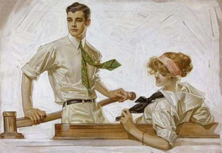 two women and a man standing next to each other in front of a fence